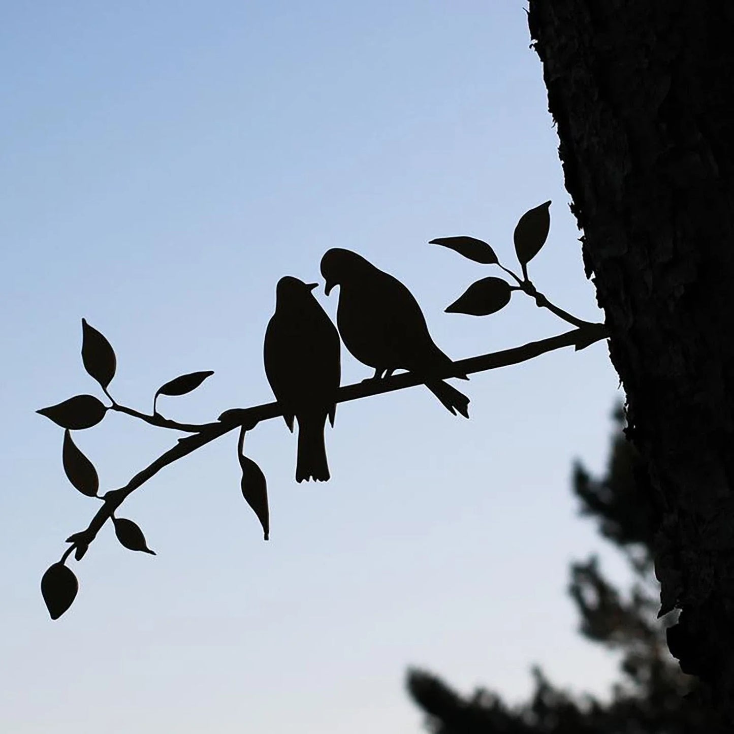 Detailed metal hummingbird ornament in various styles for garden and outdoor decor