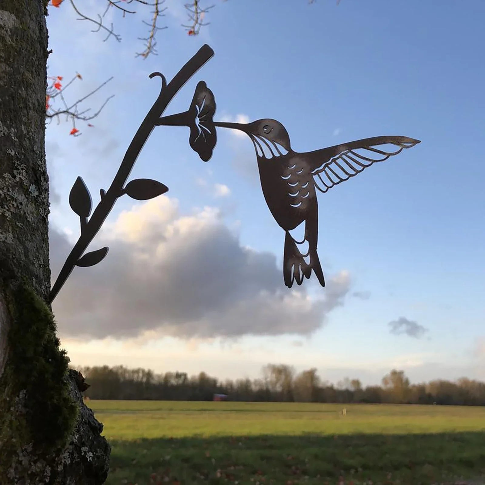 Detailed metal hummingbird ornament in various styles for garden and outdoor decor