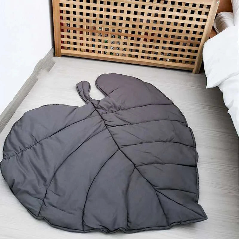 Green and grey cotton baby crawling mat with tree leaf design