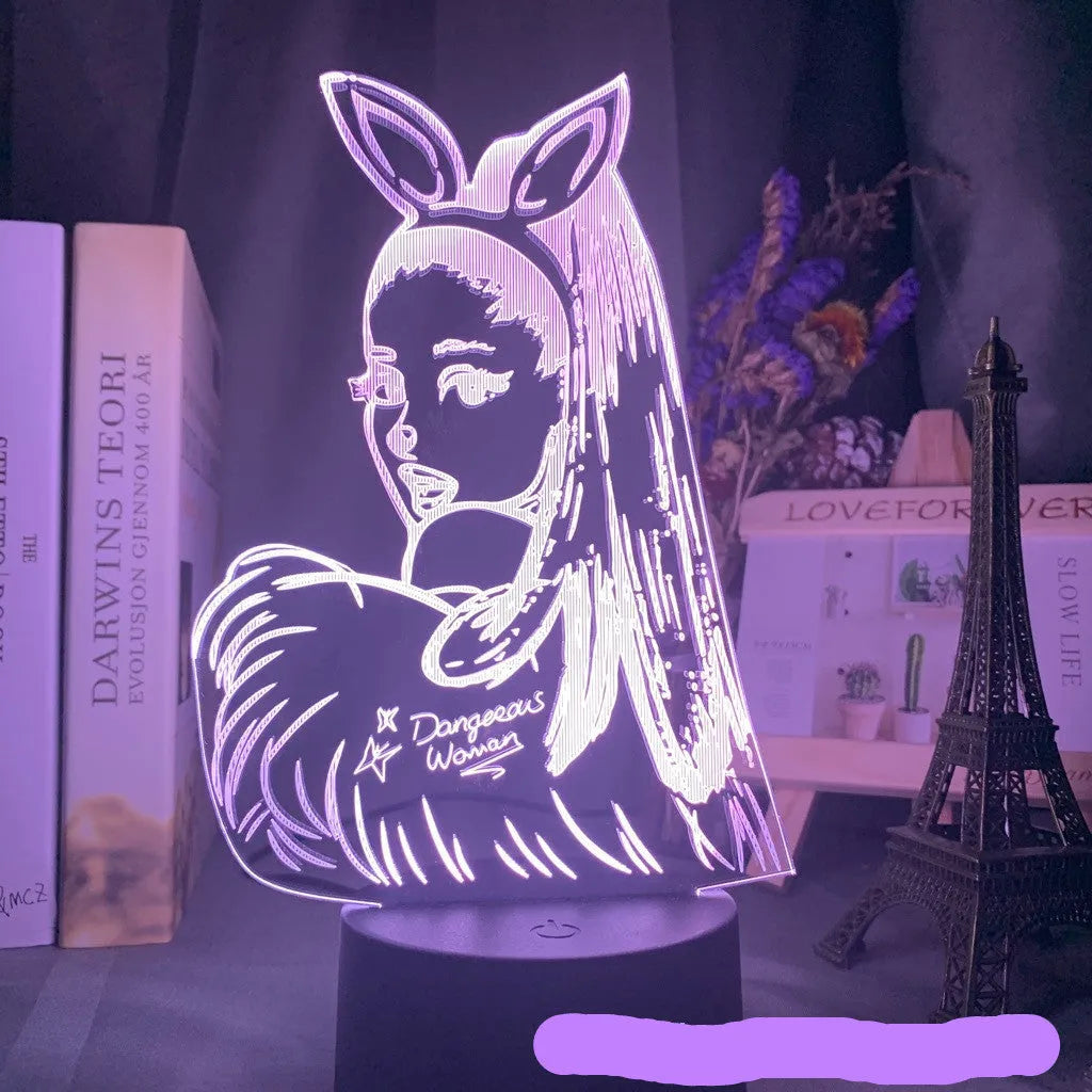 Black remote control LED desk lamp with acrylic shade on a desk