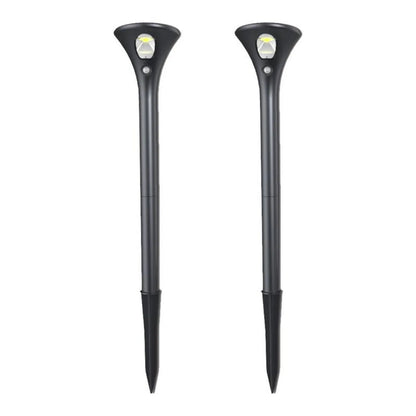 Solar-powered ground plug lawn light with metal stake and white LED lamp for outdoor pathways.