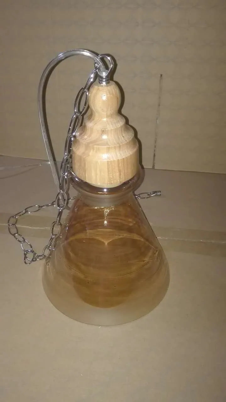 Glass wood grain single head pendant light with adjustable cord in Nordic style.