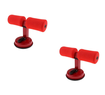 Compact sit-up strength trainer with steel springs and foam padding for home fitness