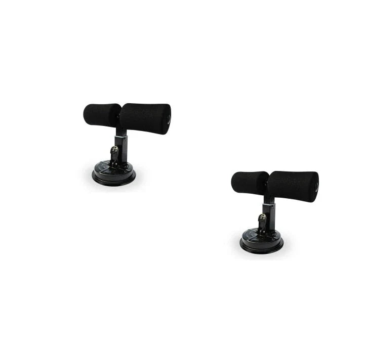 Compact sit-up strength trainer with steel springs and foam padding for home fitness