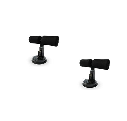 Compact sit-up strength trainer with steel springs and foam padding for home fitness