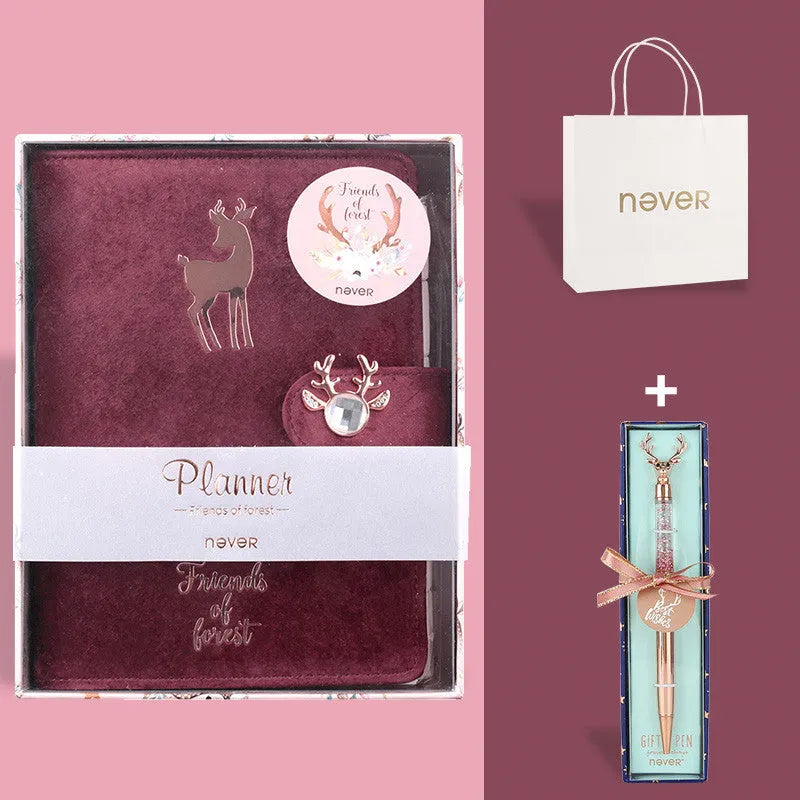 A6 loose-leaf notebook with blue velvet cloth cover open to show binder rings and paper.