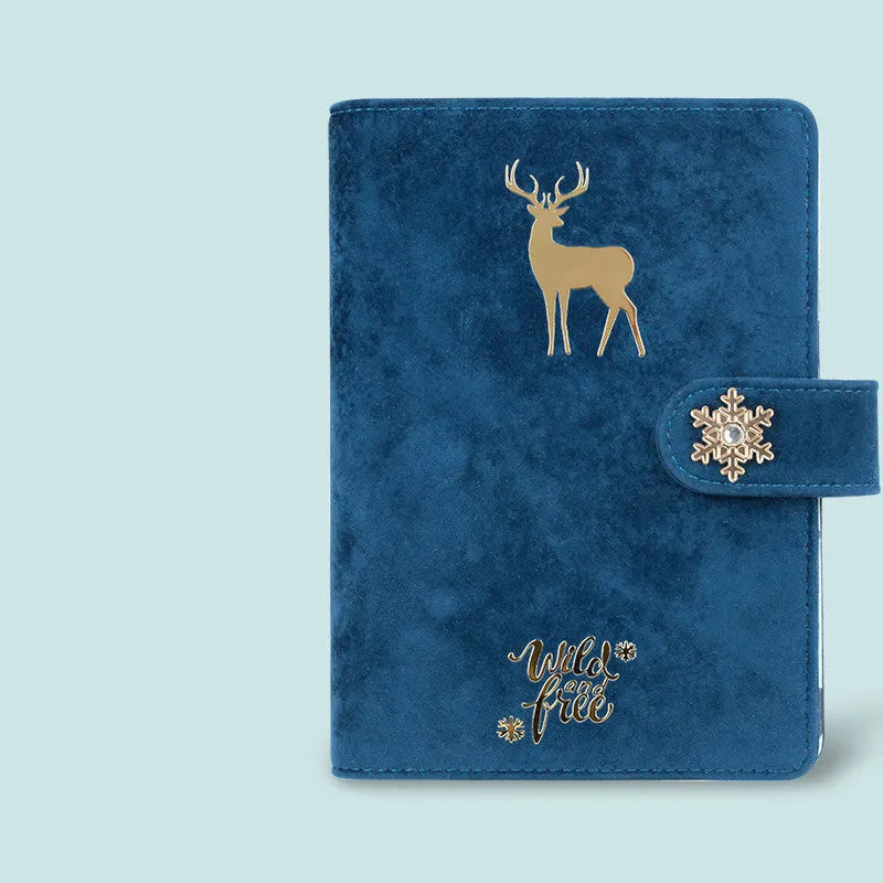 A6 loose-leaf notebook with blue velvet cloth cover open to show binder rings and paper.