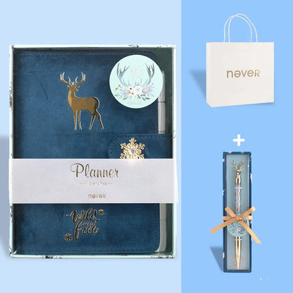 A6 loose-leaf notebook with blue velvet cloth cover open to show binder rings and paper.