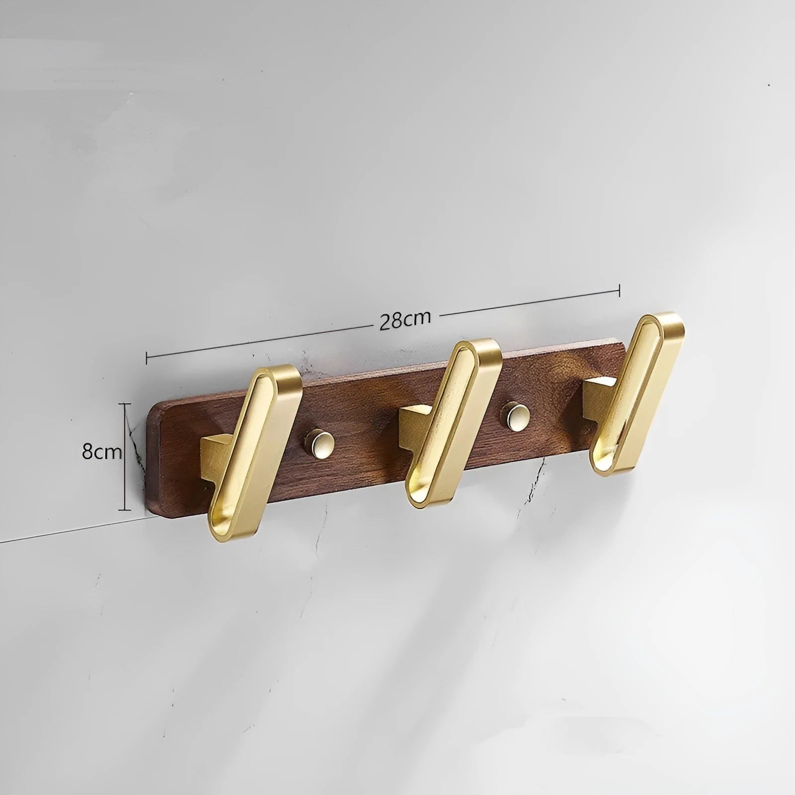 Black walnut wood clothes hooks with brass-finished aluminium frame in a 4-hook wall-mounted style