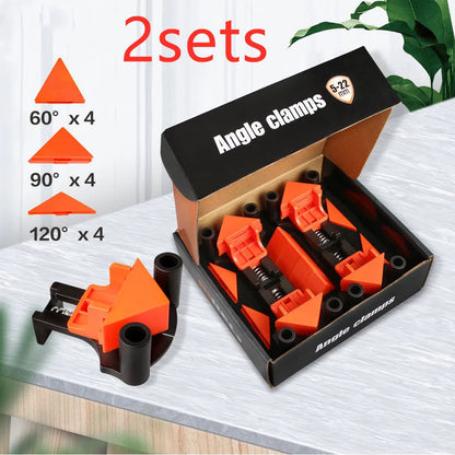 Four white plastic right angle clamps for woodworking and picture frame assembly on a workbench.