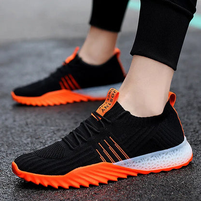 Flying woven mesh breathable sneakers in white orange, white green or black orange with rubber sole and flat heel