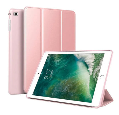 Black clamshell iPad case with a fold-out silicone stand on the back, shown next to a pink variant.