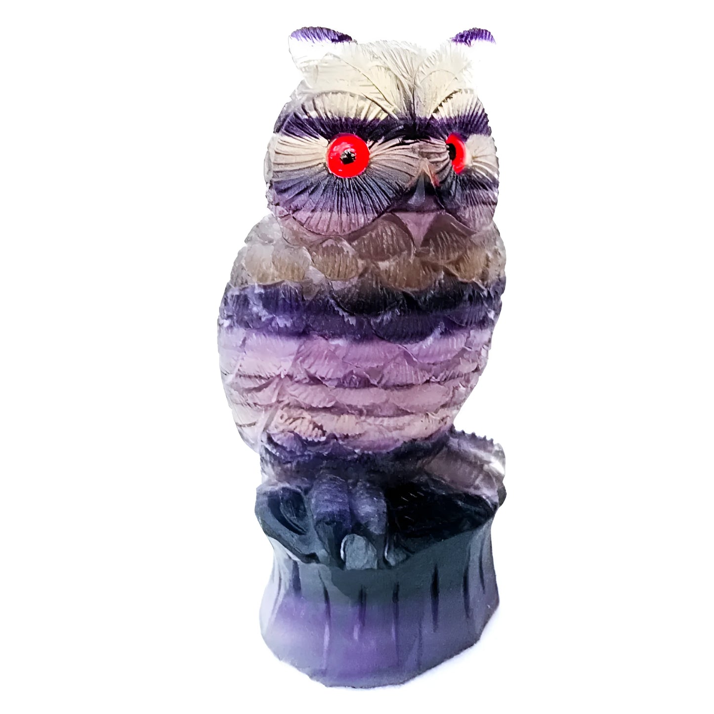 Hand-carved purple fluorite owl ornament on a neutral background, showing detailed carving and natural stone colour.