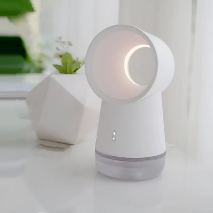 White round desktop humidifier with leafless fan, USB cable, and single mist outlet on a desk