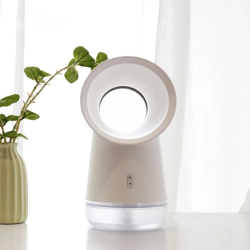 White round desktop humidifier with leafless fan, USB cable, and single mist outlet on a desk