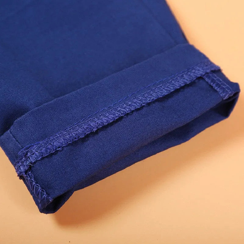 Blue boys' formal clothing set with turtleneck, waistcoat, tie, and trousers for toddlers.