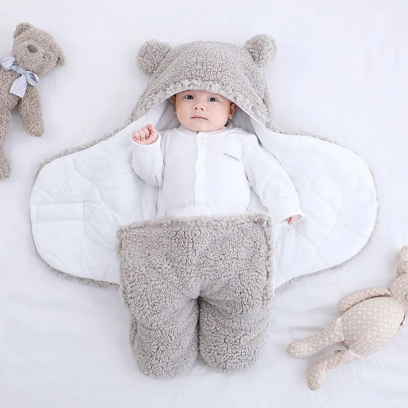Baby quilted sleeping bag wrapper in cotton blend fabric showing size and colour options