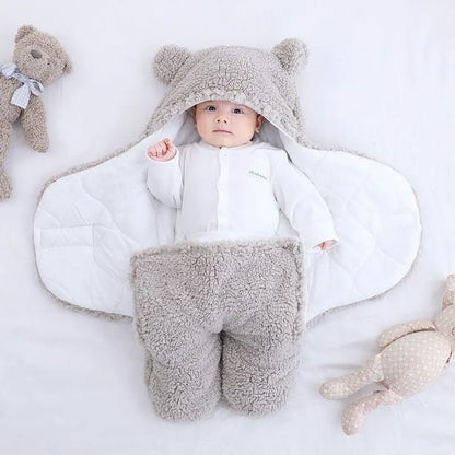 Baby quilted sleeping bag wrapper in cotton blend fabric showing size and colour options