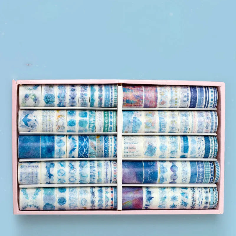 Box of 100 antique character decorative paper tape rolls in assorted colours and widths for accounting and crafts.