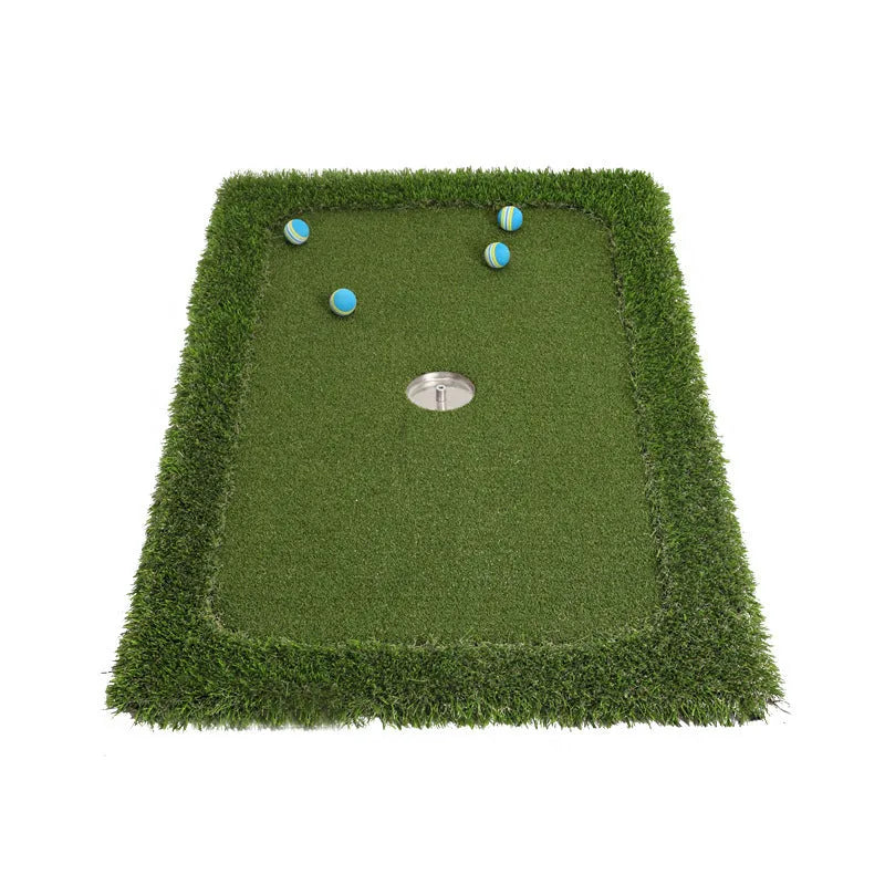 Green golf training mat on floor showing artificial grass surface and thick EVA foam base edge.
