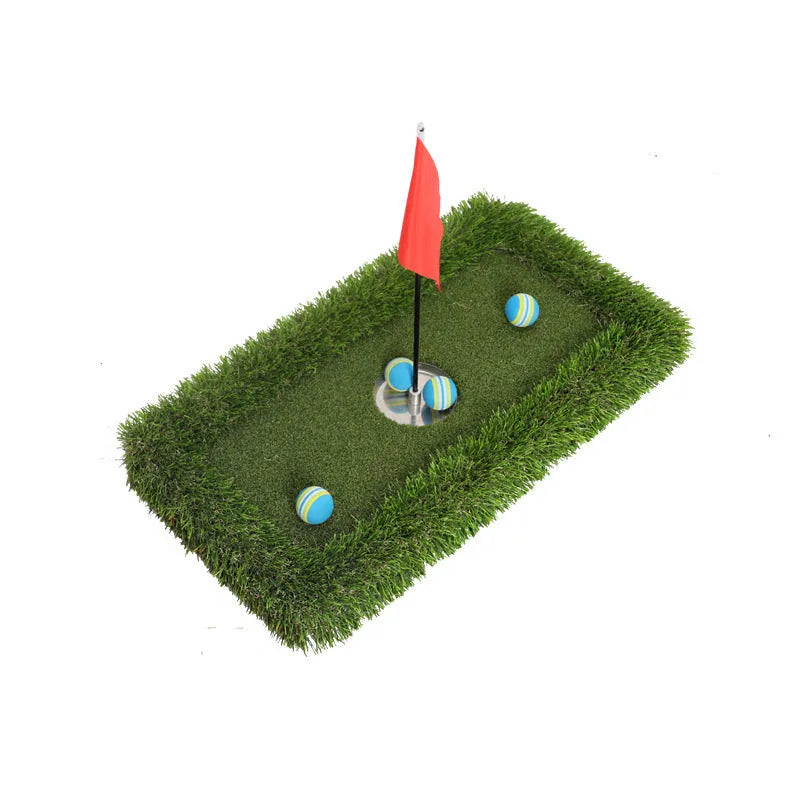 Green golf training mat on floor showing artificial grass surface and thick EVA foam base edge.