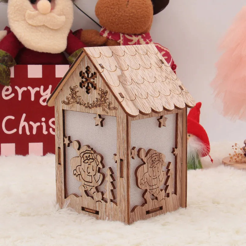 Three wooden Christmas house decorations: a small bell, a Santa Claus house, and a snowman house on a festive backdrop.