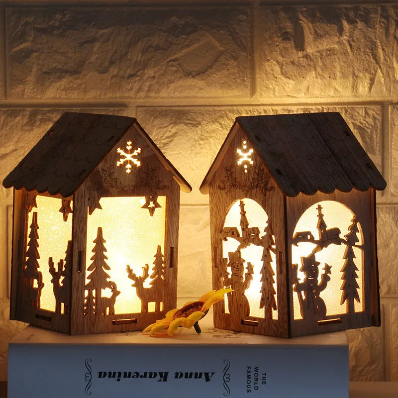 Wooden Christmas decorations set of three small handmade wooden houses with bell, snowman, and Santa Claus figures for festive table centrepiece and tree ornaments, natural wood colour