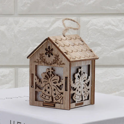 Three wooden Christmas house decorations: a small bell, a Santa Claus house, and a snowman house on a festive backdrop.