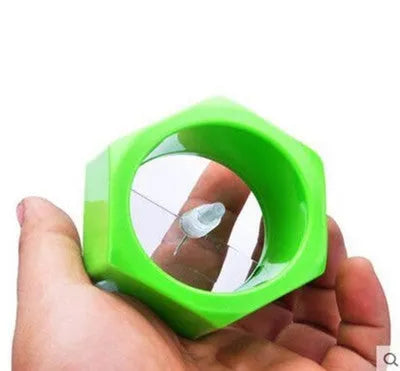 Yellow and green kitchen vegetable cutter creating cucumber spirals with food-grade ABS plastic construction