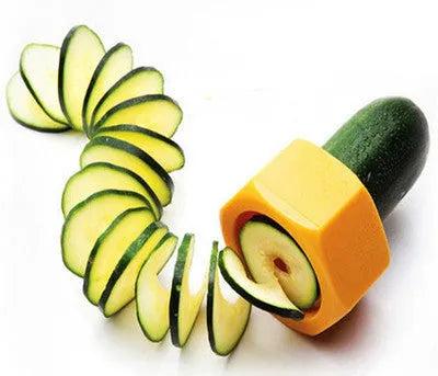 Yellow and green kitchen vegetable cutter creating cucumber spirals with food-grade ABS plastic construction