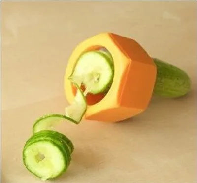 Yellow and green kitchen vegetable cutter creating cucumber spirals with food-grade ABS plastic construction