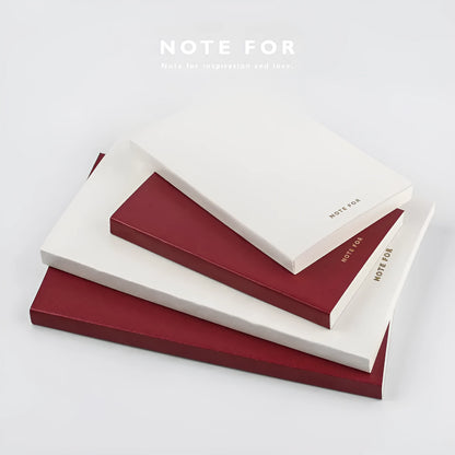 Red and white A5 and A6 notebooks with imitation leather covers, showing dot grid, squared, and lined page options.