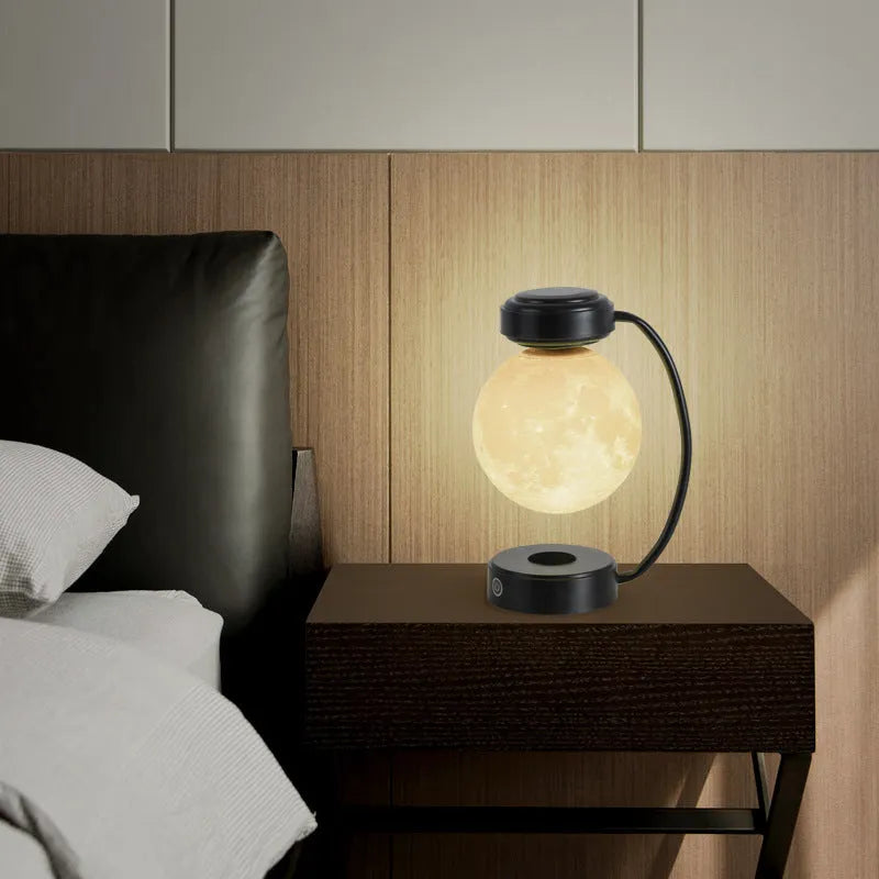Magnetic levitation moon lamp floating above base with three colour changing effects