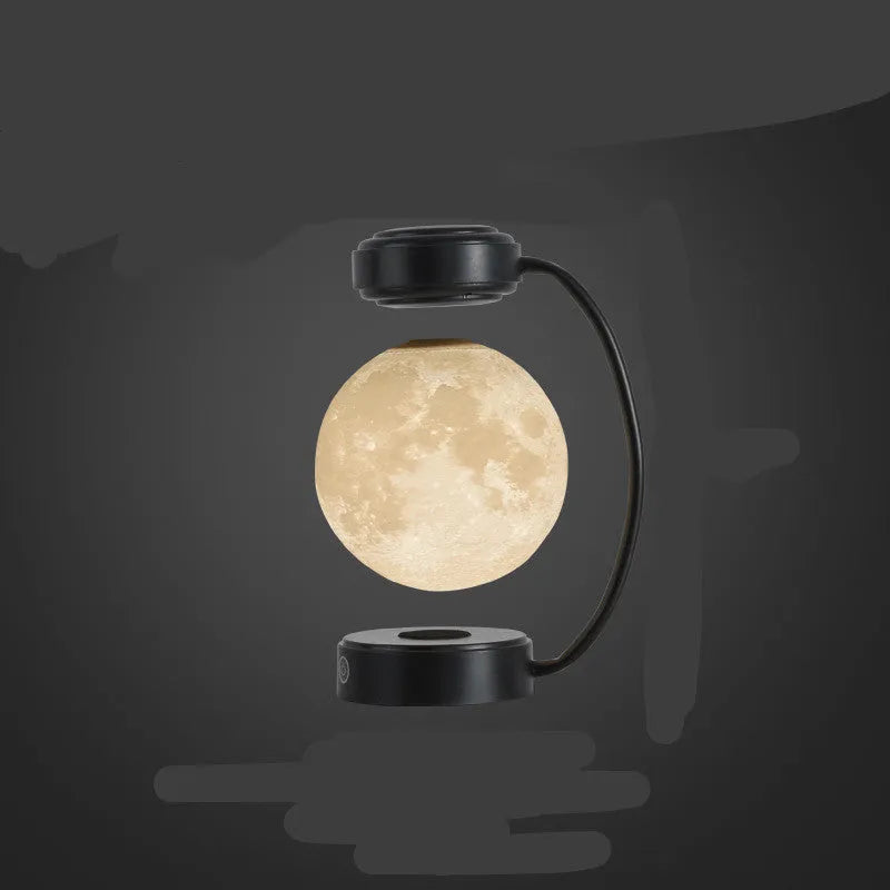 Magnetic levitation moon lamp floating above base with three colour changing effects