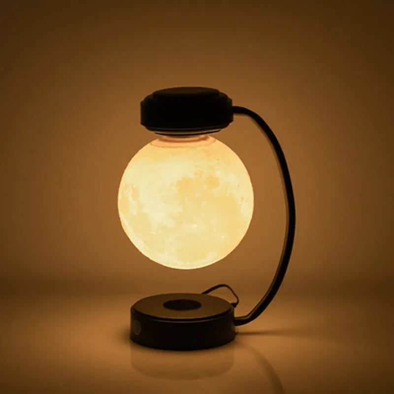 Magnetic levitation moon lamp floating above base with three colour changing effects