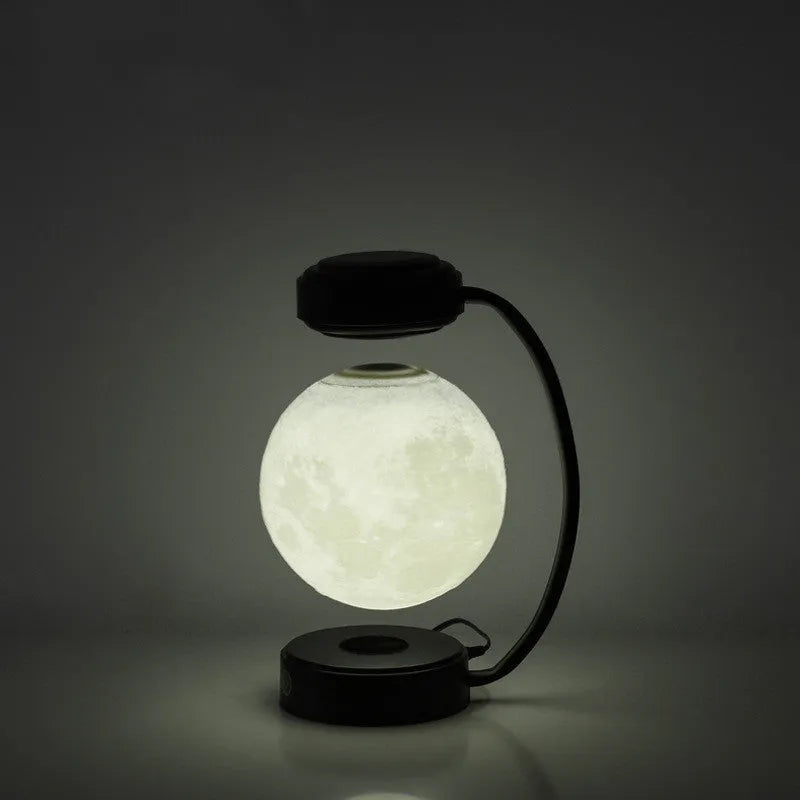 Magnetic levitation moon lamp floating above base with three colour changing effects