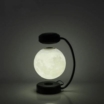 Magnetic levitation moon lamp floating above base with three colour changing effects