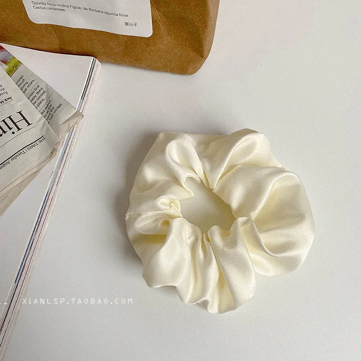 Silk large intestine ring hair tie in multiple colours showing woven construction and 3cm diameter