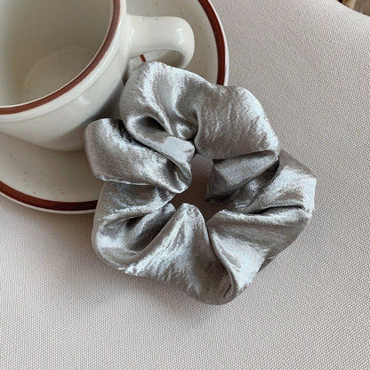 Silk large intestine ring hair tie in multiple colours showing woven construction and 3cm diameter