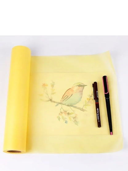 Aikale white and yellow drawing paper rolls in 12-inch and 18-inch widths on a wooden table.