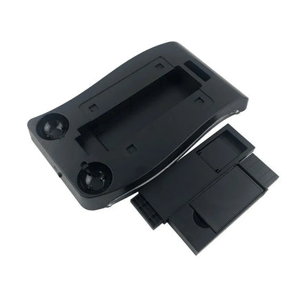 Black ABS charging base for PlayStation 4 VR controllers on a gaming desk