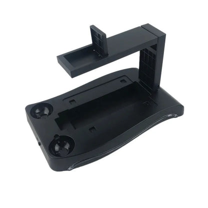 Black ABS charging base for PlayStation 4 VR controllers on a gaming desk