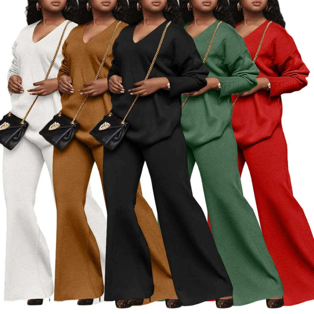 Women's brown suede two-piece suit with split sleeves on top and matching trousers