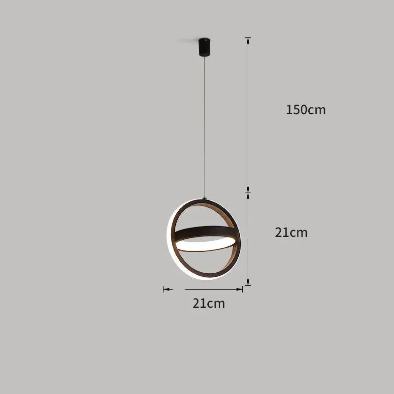 Minimalist black iron single head chandelier with remote control on a bedside table.