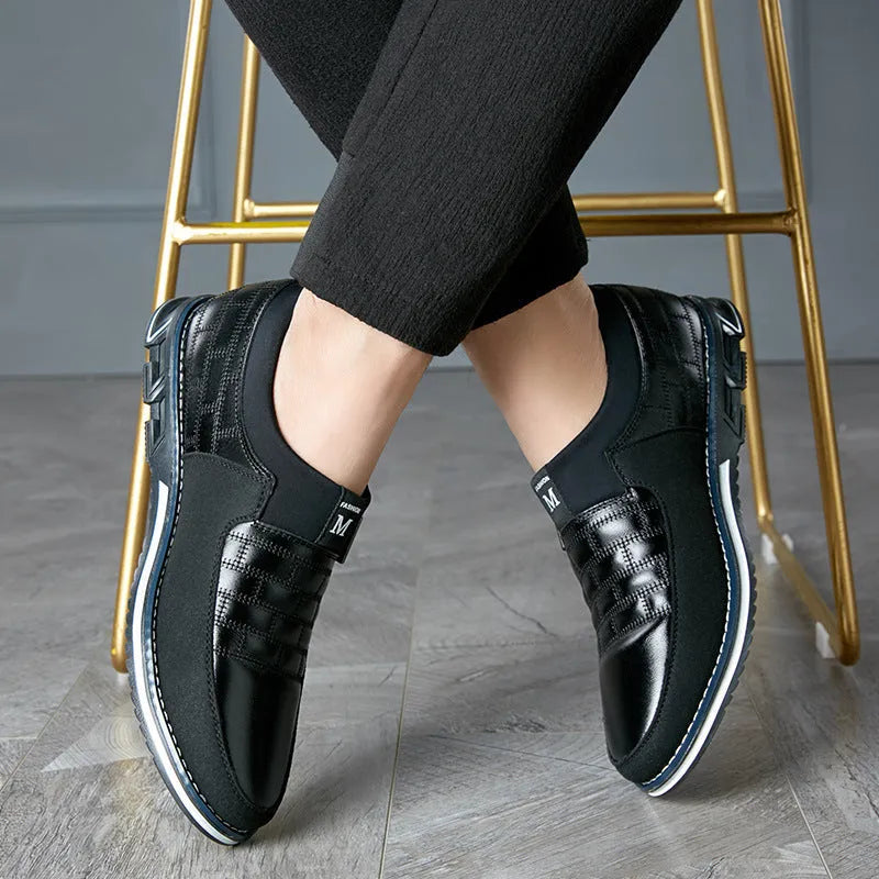 Men's low-cut blue leather casual shoes on a white background, showing the leisure design.