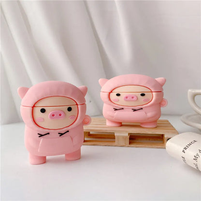 Pink silicone cartoon pig flip-case for AirPods with a metal carry hook attached.