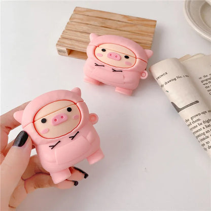 Pink silicone cartoon pig flip-case for AirPods with a metal carry hook attached.