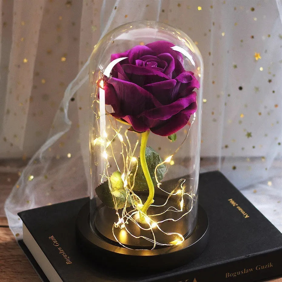 LED simulation rose ornament with glass lampshade on a solid wood base, showing a choice of rose colours.