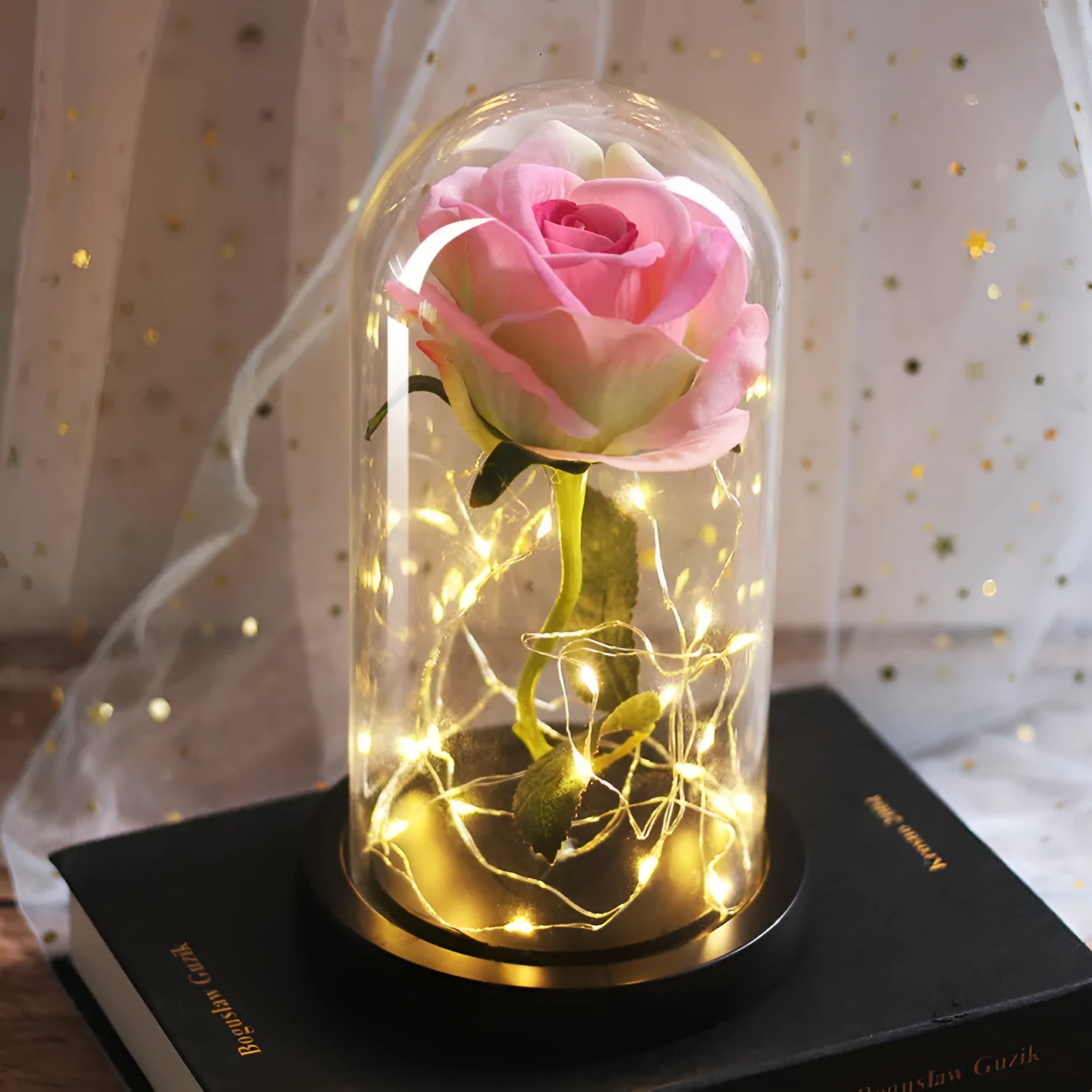 LED simulation rose ornament with glass lampshade on a solid wood base, showing a choice of rose colours.