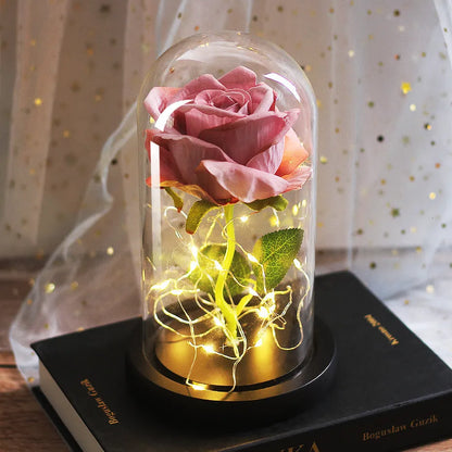 LED simulation rose ornament with glass lampshade on a solid wood base, showing a choice of rose colours.